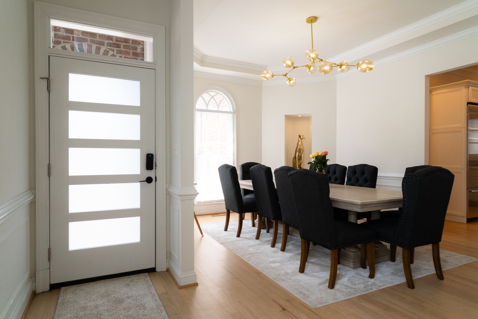 Modern frosted glass entry door with transom